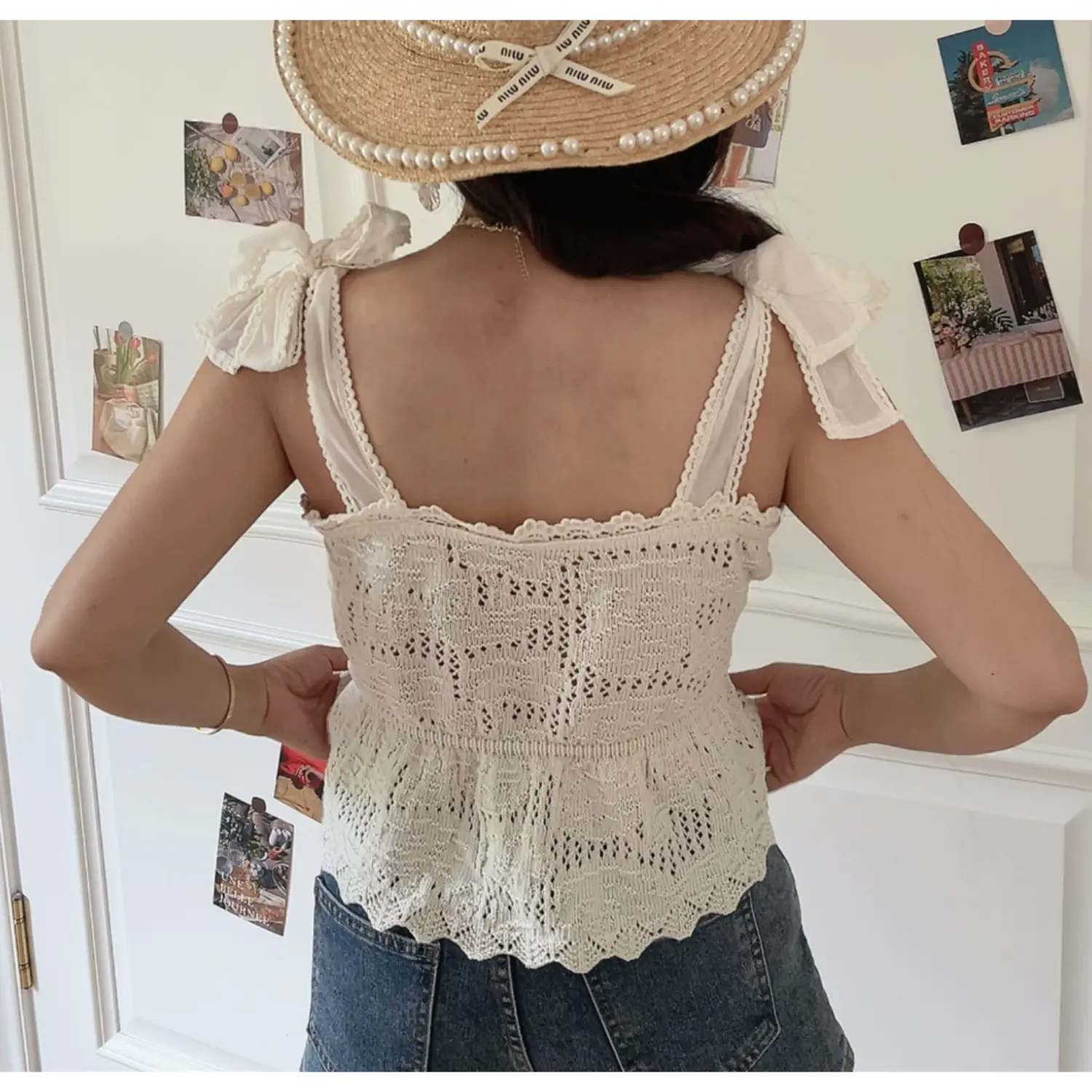 Back lifestyle shot square neck knitted cami, detachable fabric shoulder bows, scalloped hem peplum waist