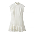 Full front view of white jacquard cheongsam dress, featuring the mandarin collar, sleeveless design, and tiered ruffle hem
