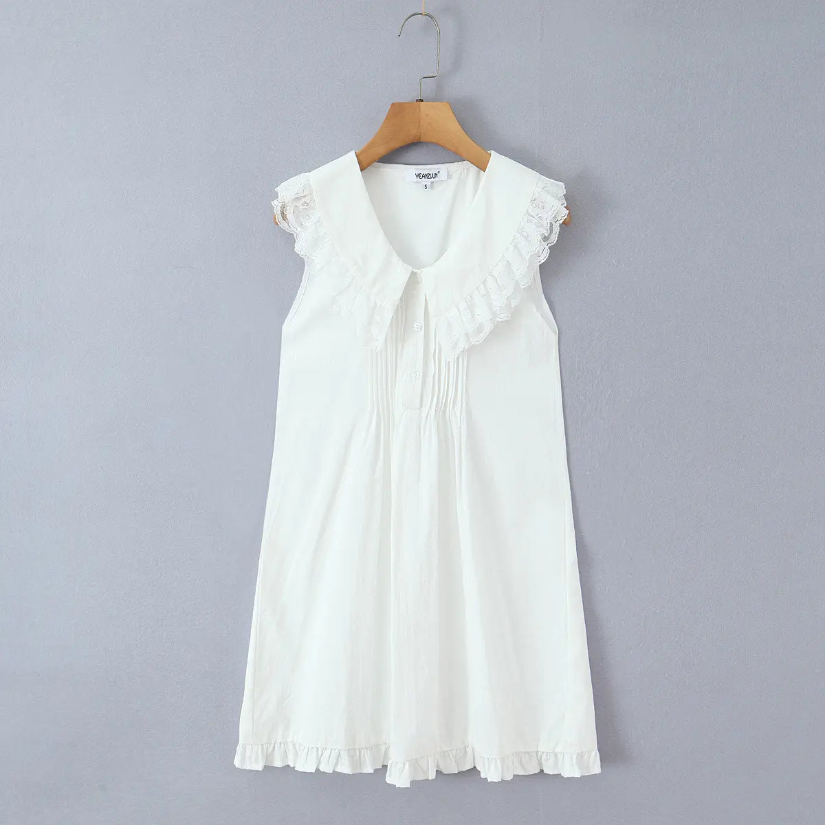  Hanging front view of the dress, highlighting the lace collar, pintuck detailing, and A-line silhouette.