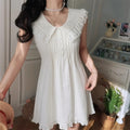 On-model view of the dress, showing the full silhouette, lace collar, and ruffled hem.