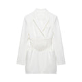 Front view white long sleeve blazer mini dress, notched lapel, fitted floral lace corset waist and side pockets