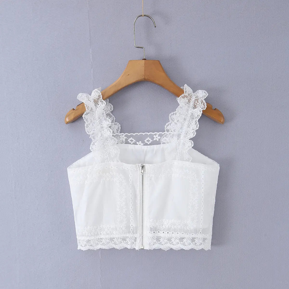 Hanging back view of the cami top, highlighting the center-back zipper and lace-trimmed neckline