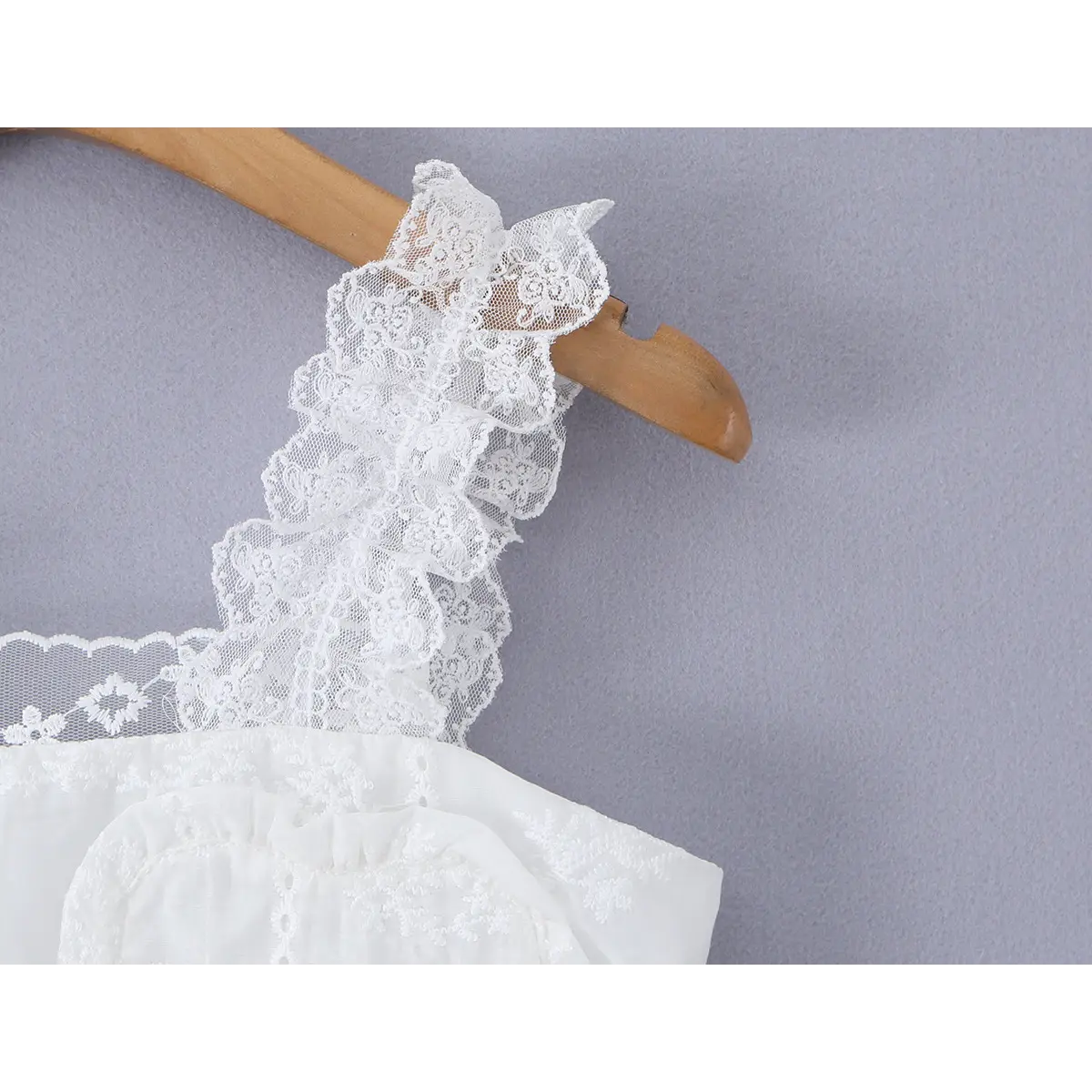 Close-up of the ruffled lace strap, showcasing the layered floral lace texture.