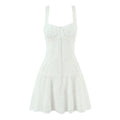 Full front view on white background of white square-neck lace mini dress with center bow and buttons