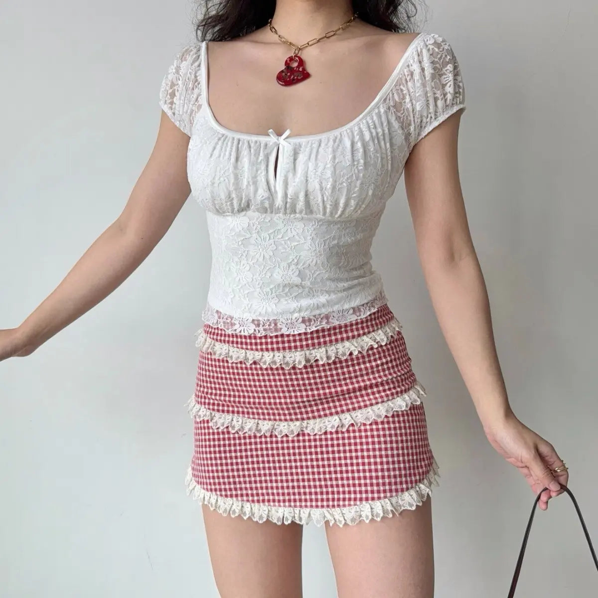 The complete outfit, including the lace top, gingham skirt, and accessories, styled in a full-body shot.