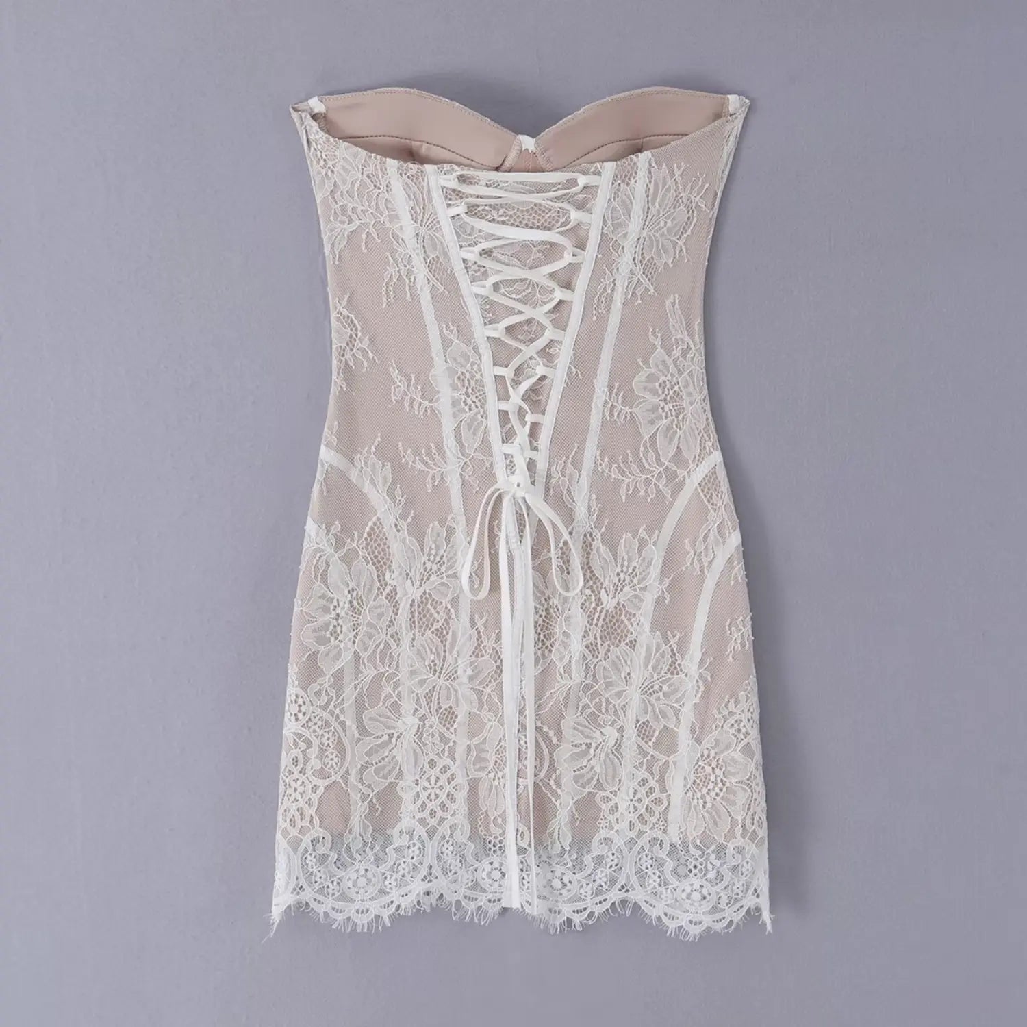 Flat lay back view white lace strapless corset mini dress with lace‑up closure
