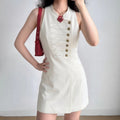 Model wearing white military inspired sleeveless mini dress, full front outfit view