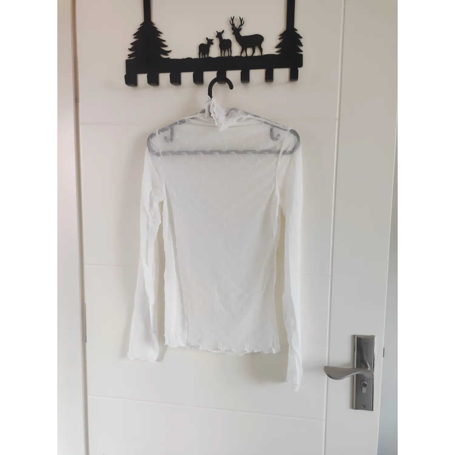 Front view white high neck mesh layering blouse with moon pattern on hanger