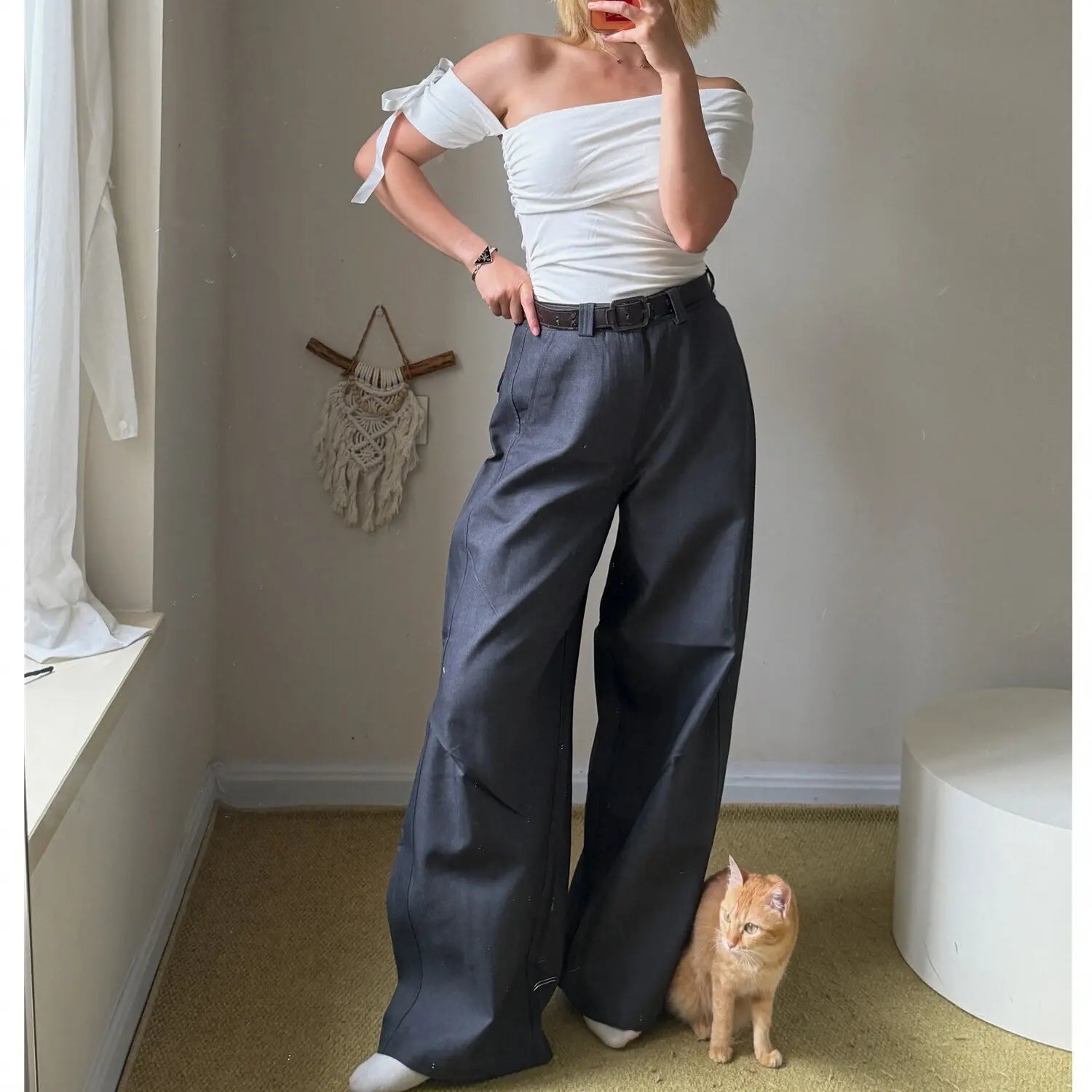 White off shoulder ruched top with detachable bow sleeve matched with charcoal gray wide leg cargo pants, full body mirror selfie outfit shot