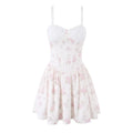 White bustier-style cami dress with pink floral print, full front view on white background