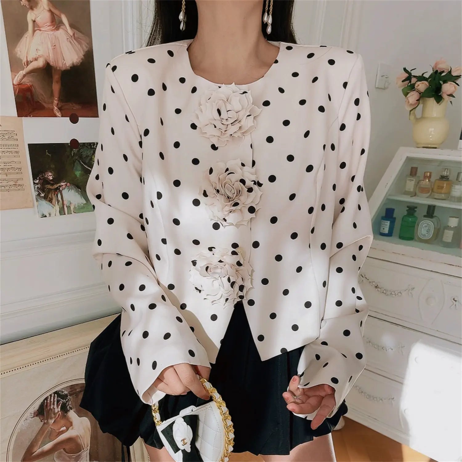 Front view medium model photo of white black polka dot cropped jacket with 3d flower details, vintage style outerwear