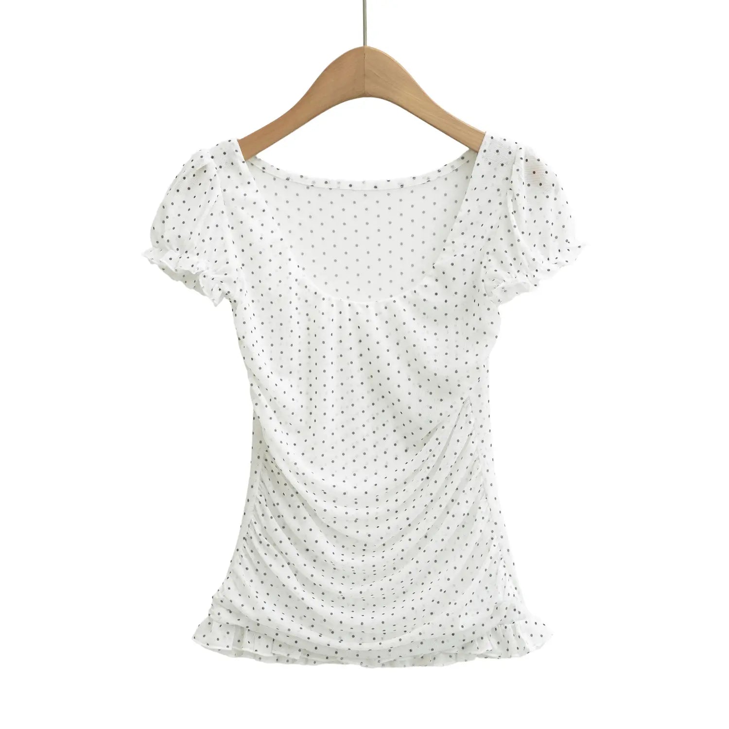 Front hanging shot on wooden hanger, white sheer mesh polka dot blouse with ruched torso and bubble sleeves