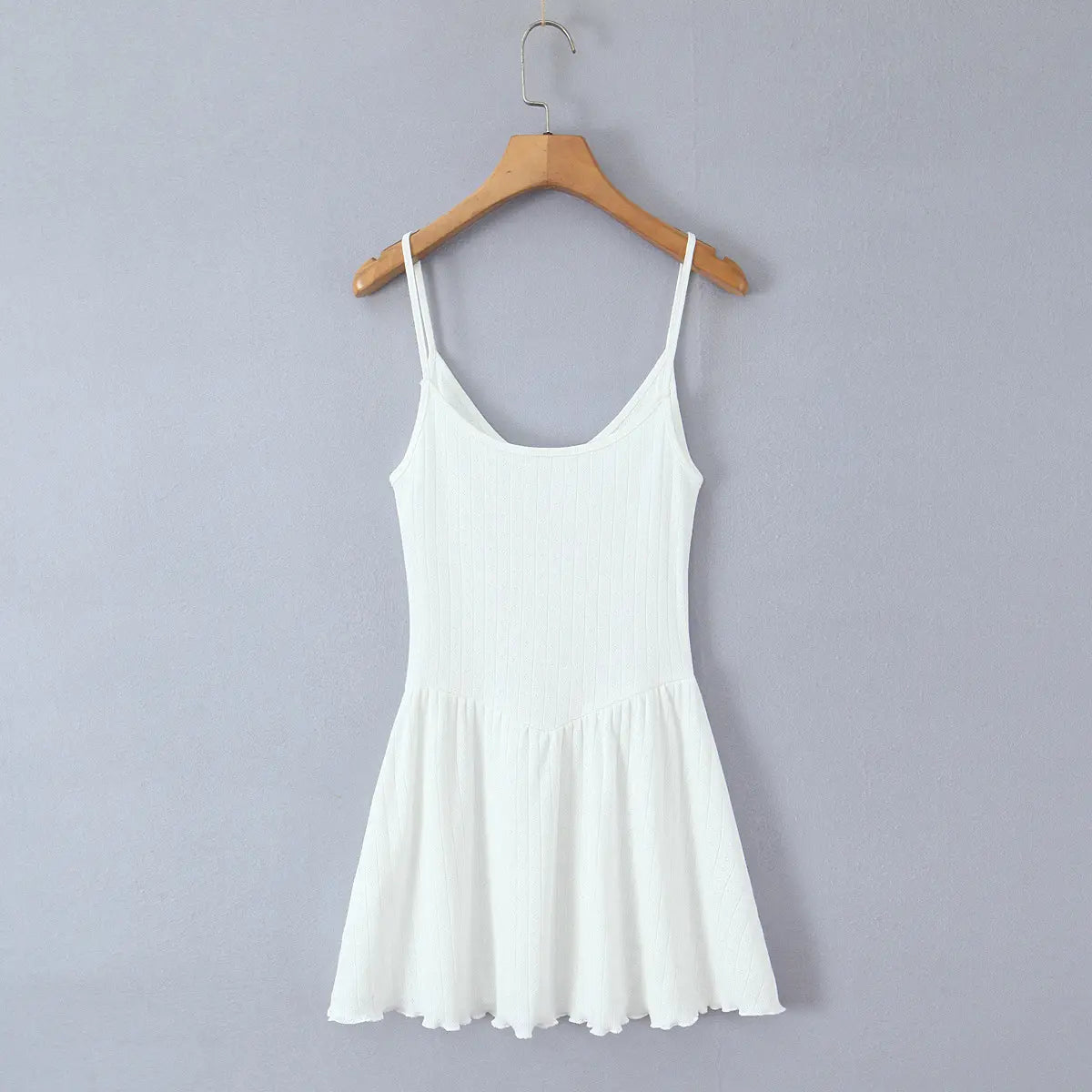 Full back view of the dress, showing the scoop neckline, thin straps, and flared, lettuce-edge skirt.