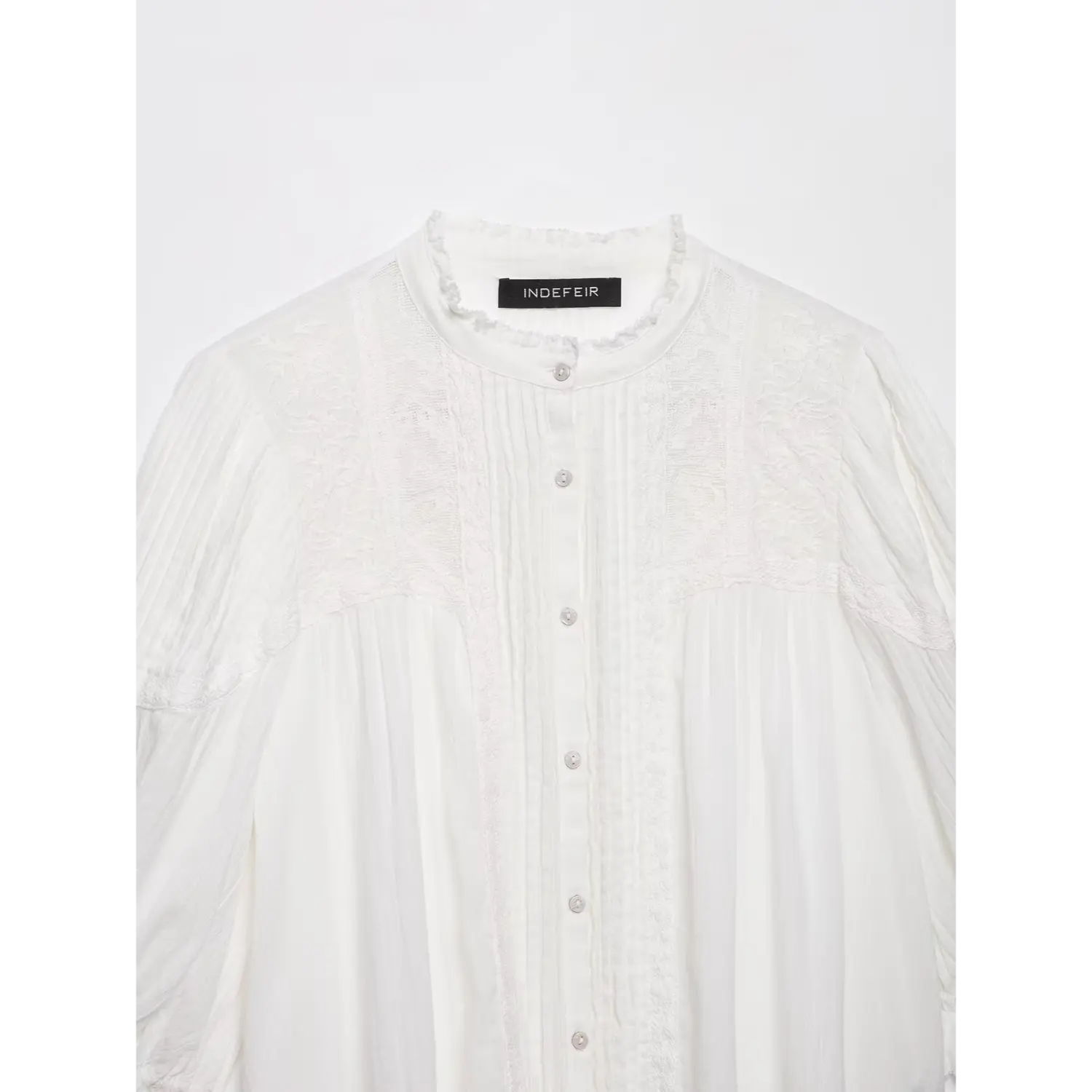 Front neckline full view, frilled mandarin collar, vertical pintuck stitching, shell buttons and side lace panels