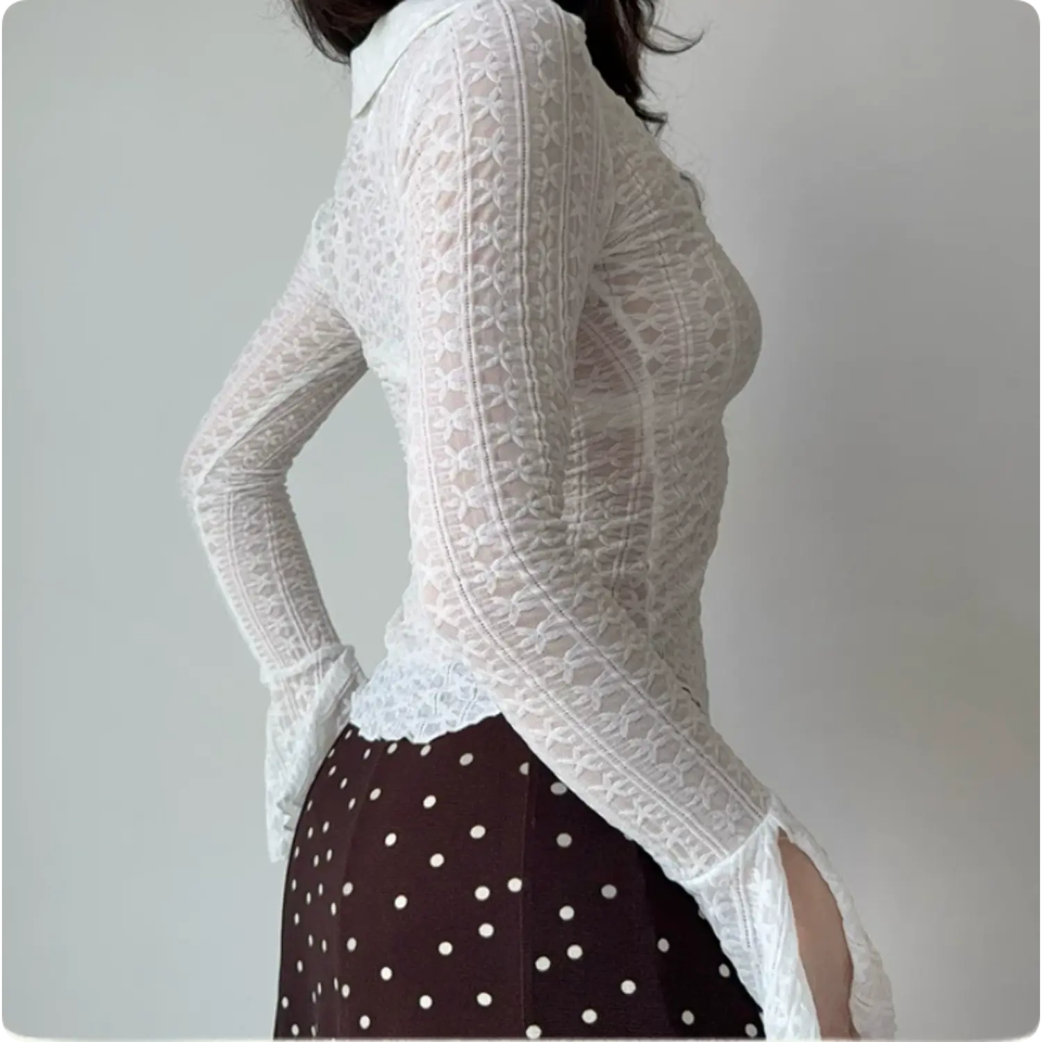 Model back side view white floral sheer lace long sleeve top slim fitted silhouette flared split sleeve cuffs
