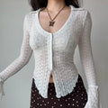Model relaxed front shot white sheer lace collared v‑neck button‑front long sleeve top scalloped uneven hem