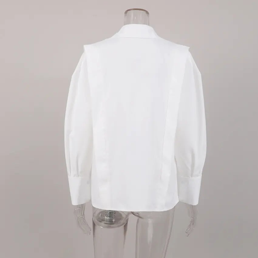 White shoulder strap button front shirt on mannequin, back view