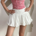 White textured mini skirt model hand on waist full body shot, highlight high waist silhouette uniform cake gathers double lace hem cropped lengthen leg proportion