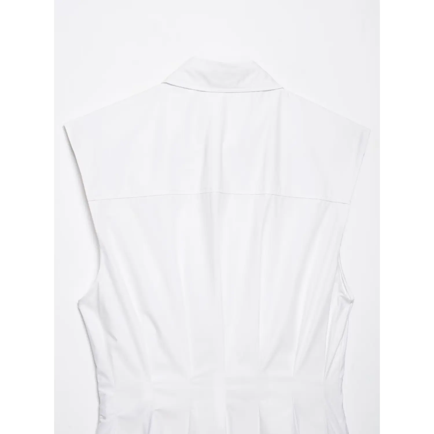 Full back flat lay view of white sleeveless collared peplum shirt