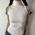 Front torso shot, white sleeveless turtleneck tank top, minimalist fitted design