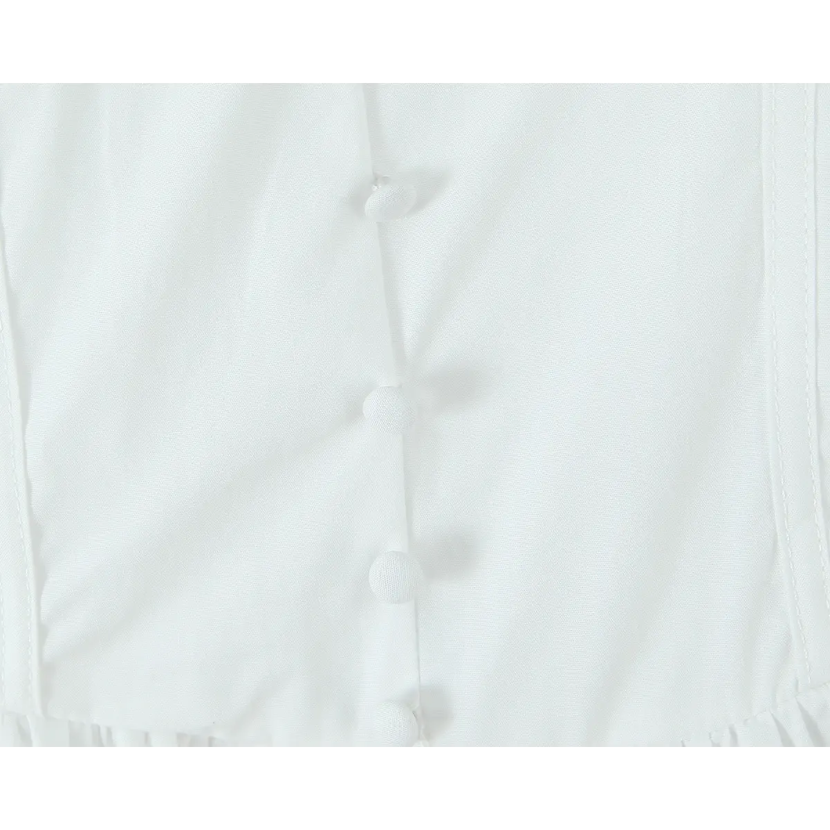 Close-up of the fabric-covered buttons on the front placket.