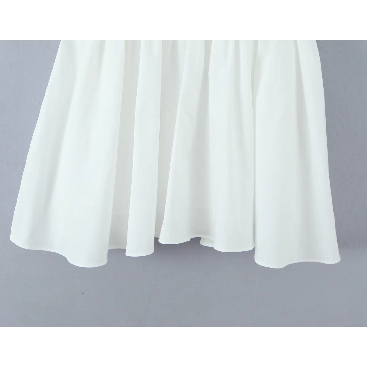 Full view of the gathered A-line skirt hem.