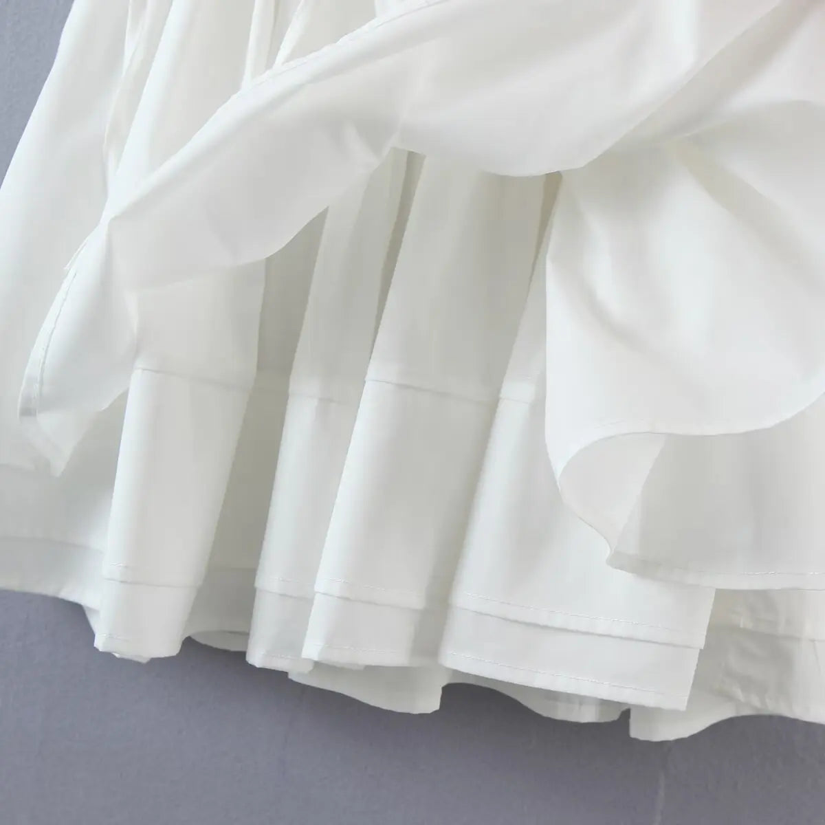 Close-up of the skirt layers, showing the outer fabric and smooth inner lining.