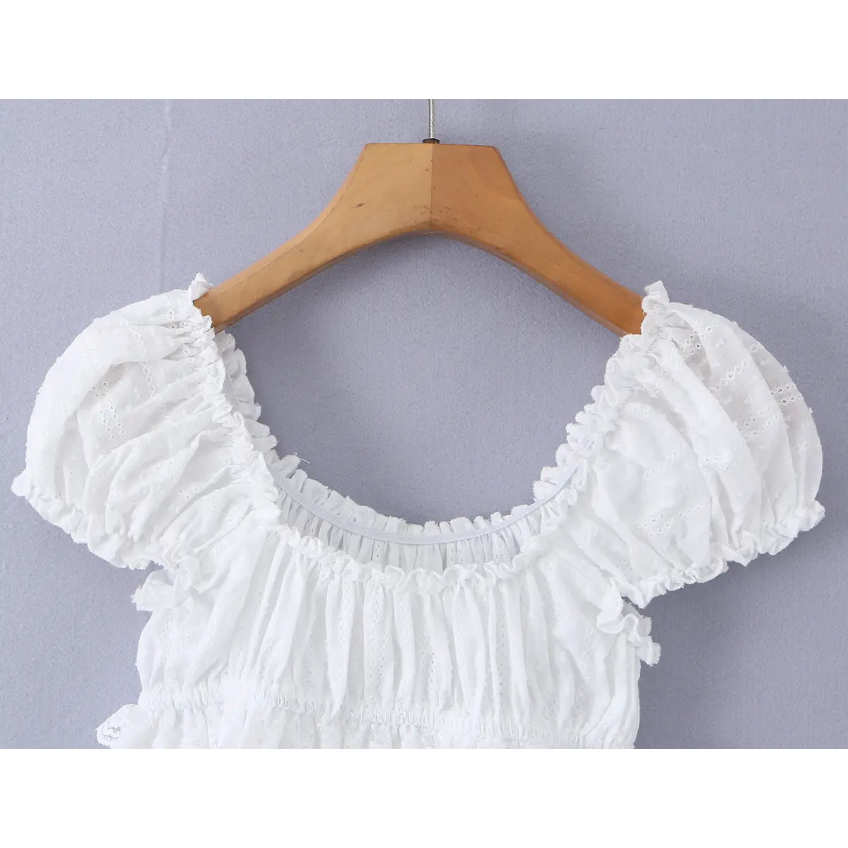 Close-up of the back view, showing the elasticated neckline and matching ruffled trim.