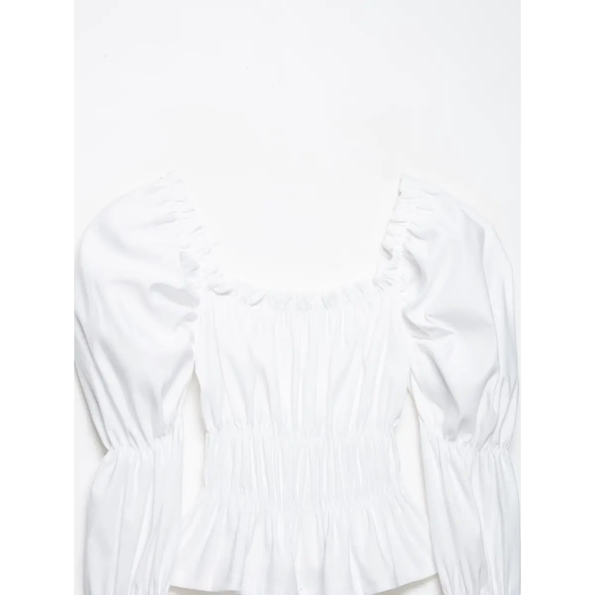 Front shot of the white top, highlighting the square neck, tiered sleeves, and fitted peplum hem.