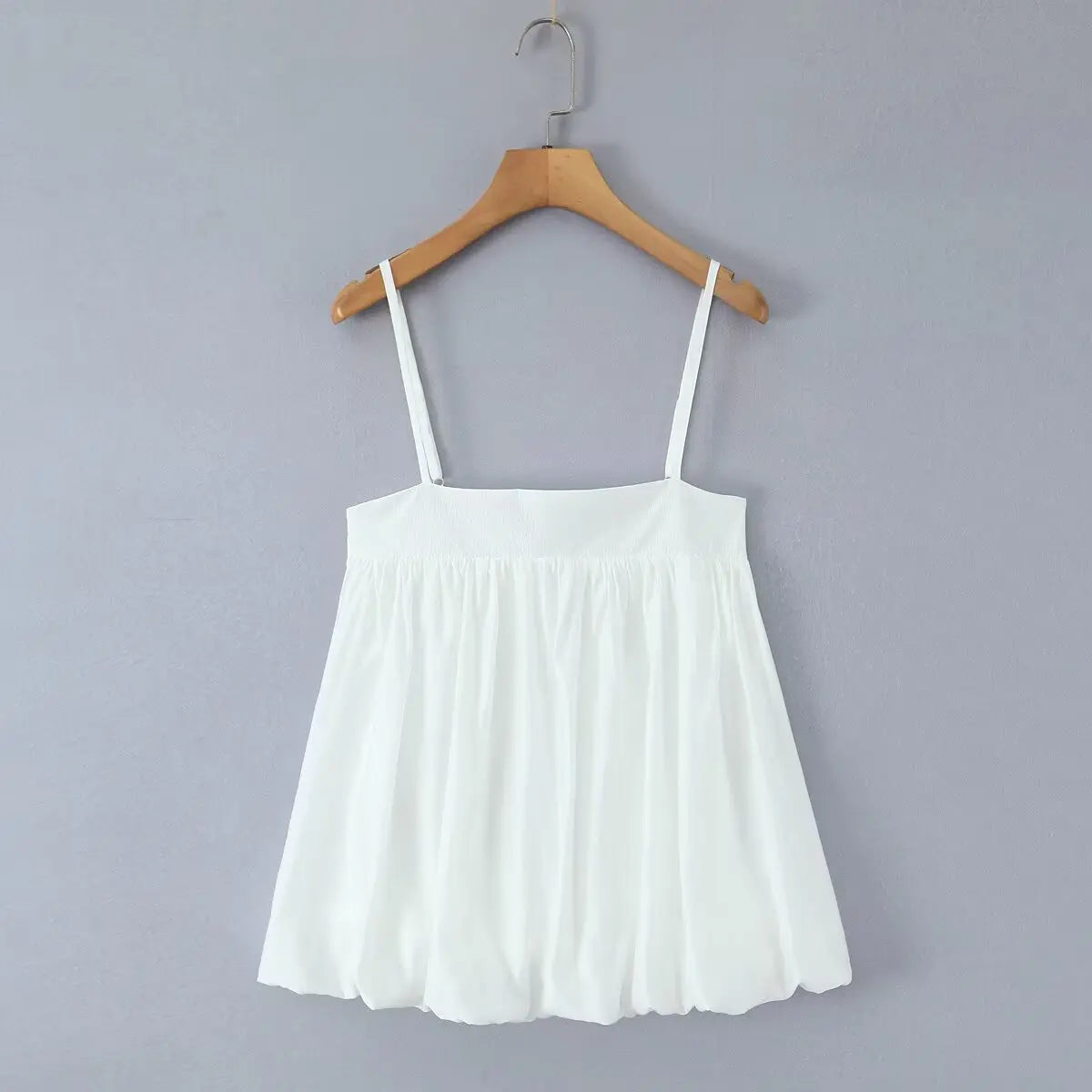 Hanging front view of the dress, showing the full silhouette with square neckline and voluminous bubble skirt.