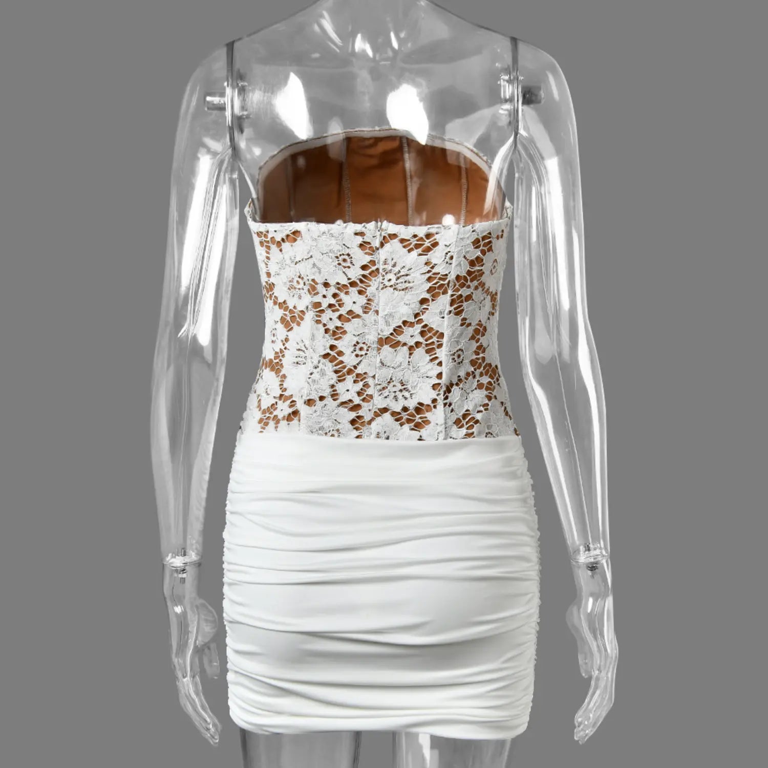 Mannequin back view white strapless floral lace bodice mini dress with ruched skirt and nude inner lining