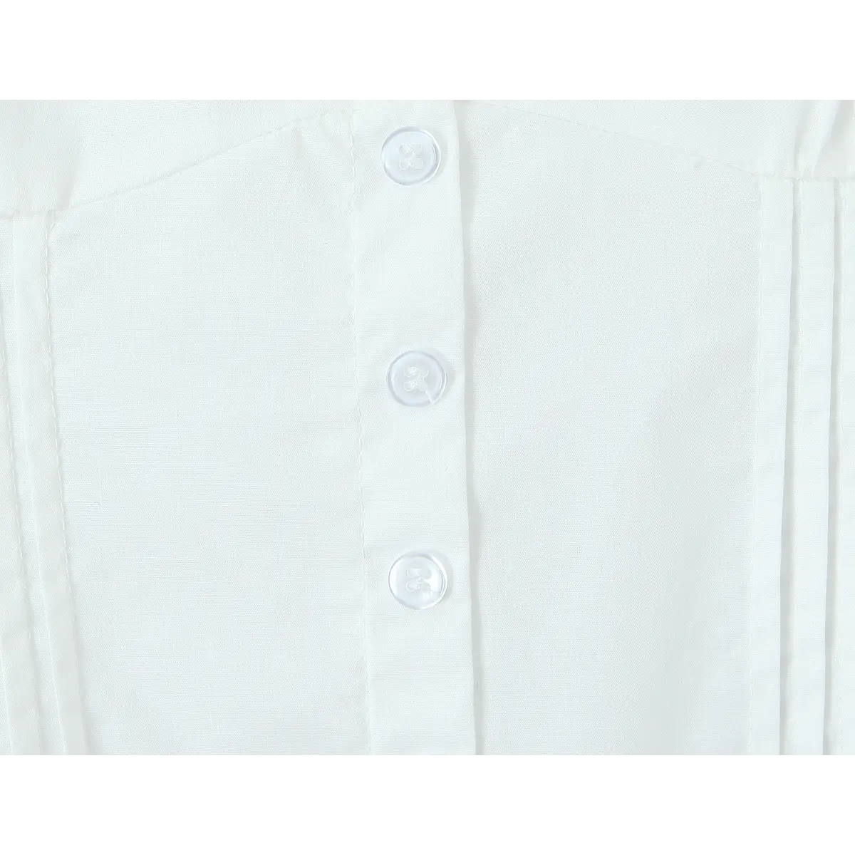 Close-up of the white center-front buttons on the dress, showing buttonhole stitching