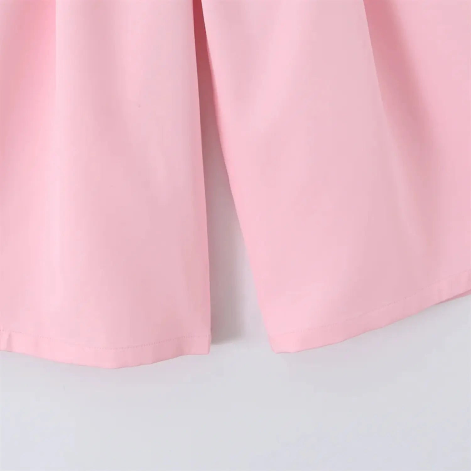 Midi leg hem close-up, wide straight leg opening, folded bottom hem stitching, clean edge finish