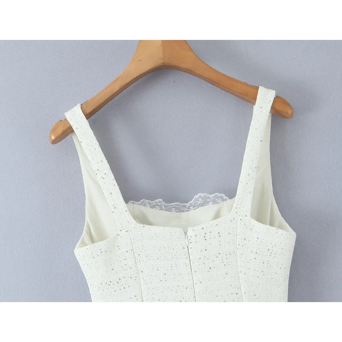 Back hanging shot, wide tweed shoulder straps, inner scalloped lace trim at square neck, center back invisible zipper.