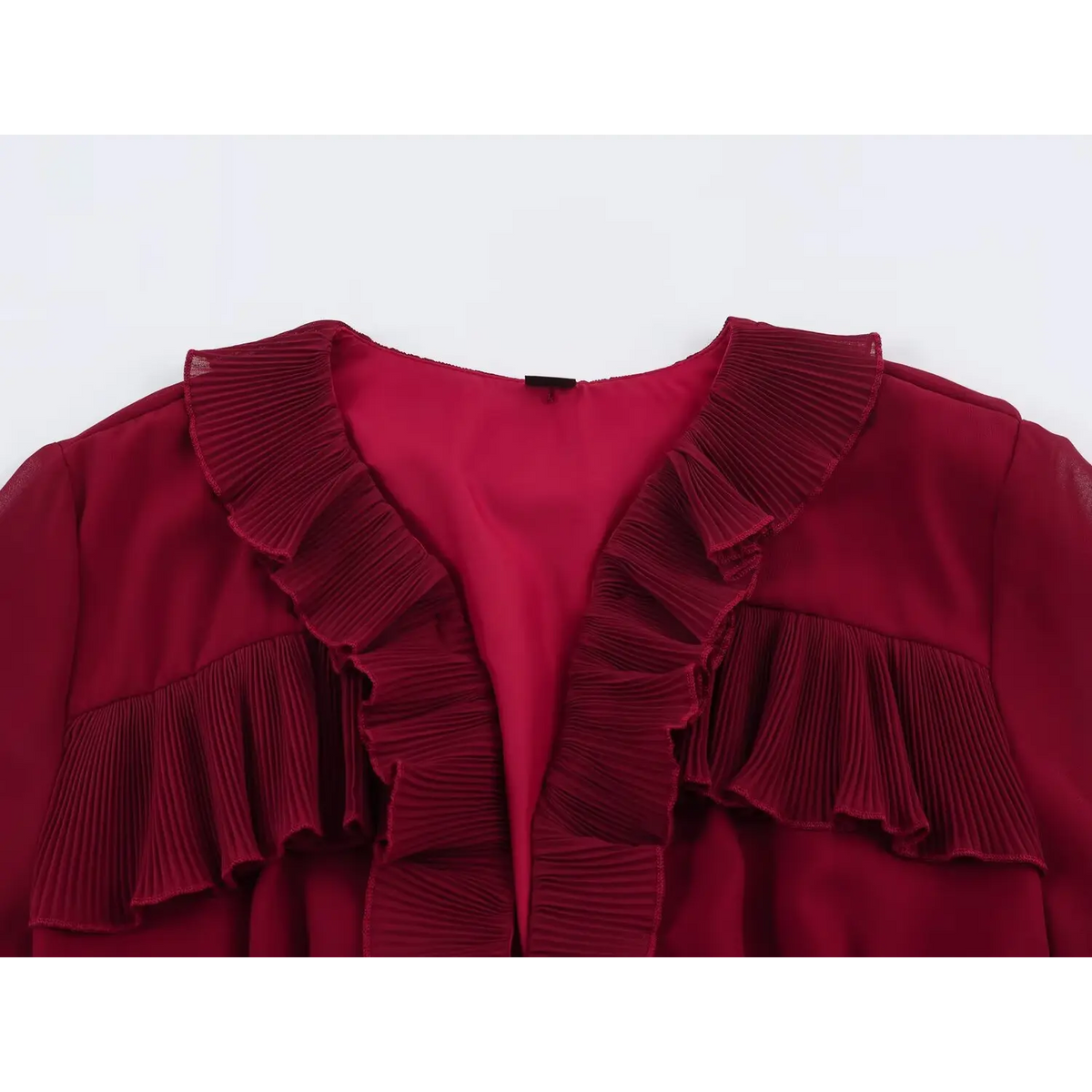 Close-up of deep V-neckline with ruffled details on wine red long sleeve maxi dress