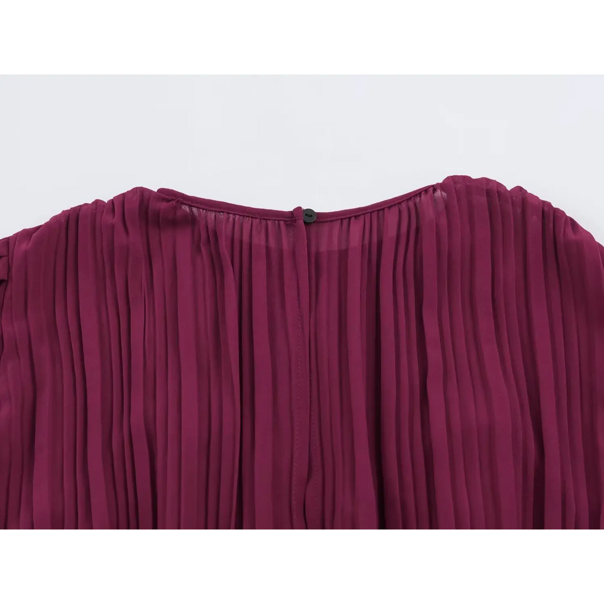 lose-up of back neckline with black button closure on wine red pleated maxi dress
