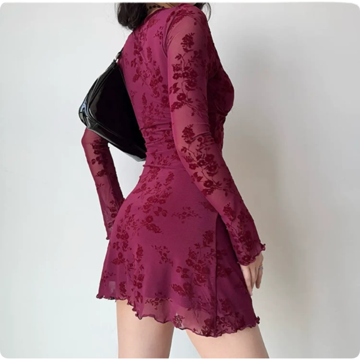 Back side shot of wine red rose flocked sheer mesh bodycon mini dress, long flared sleeve ruched slim waist women going out dress