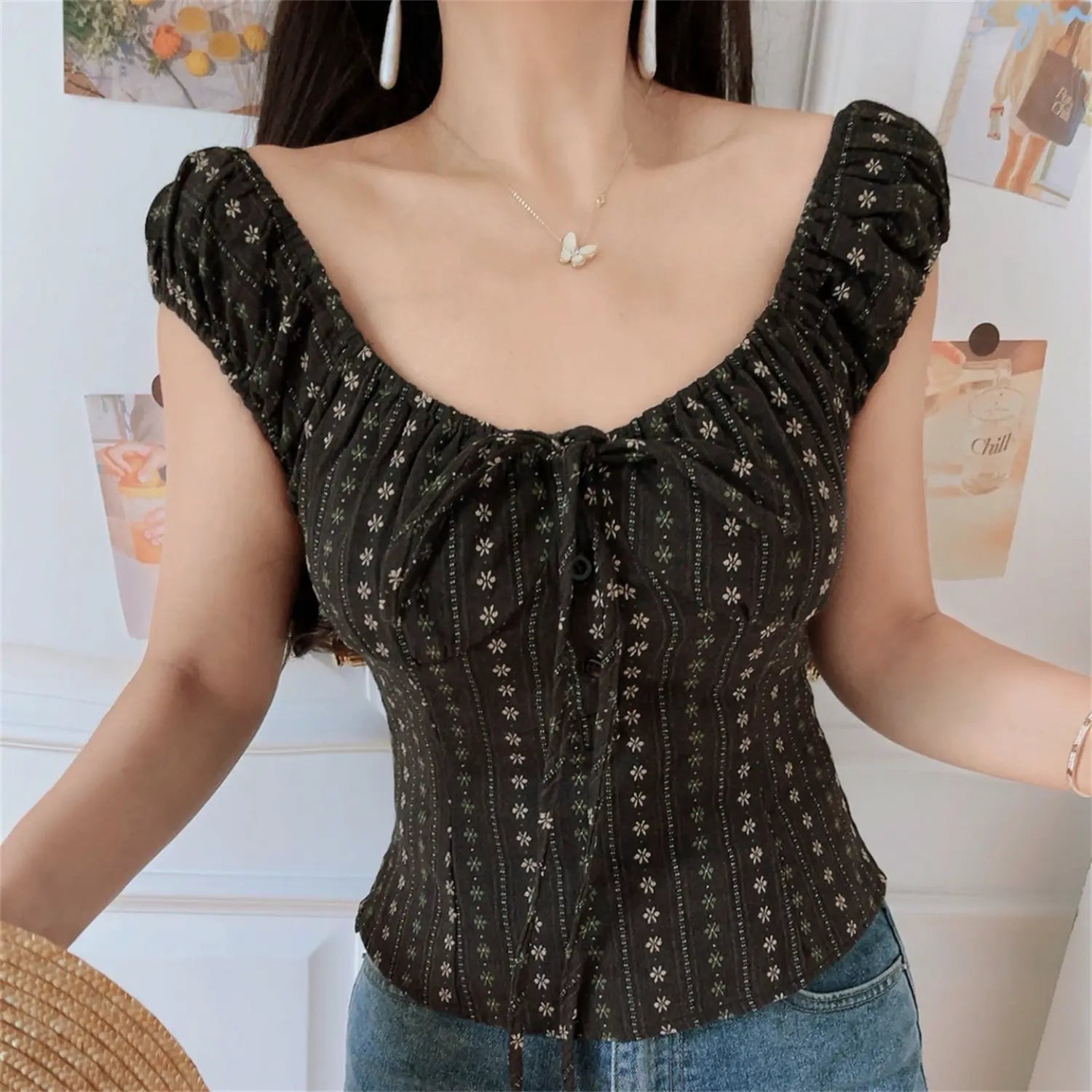 Women dark brown vertical floral two way wear crop top, square neck puff sleeve gathered fitted silhouette, indoor model with denim jeans