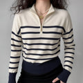Model wearing cream navy horizontal‑stripe half‑zip mock neck knit sweater, casual fitted look