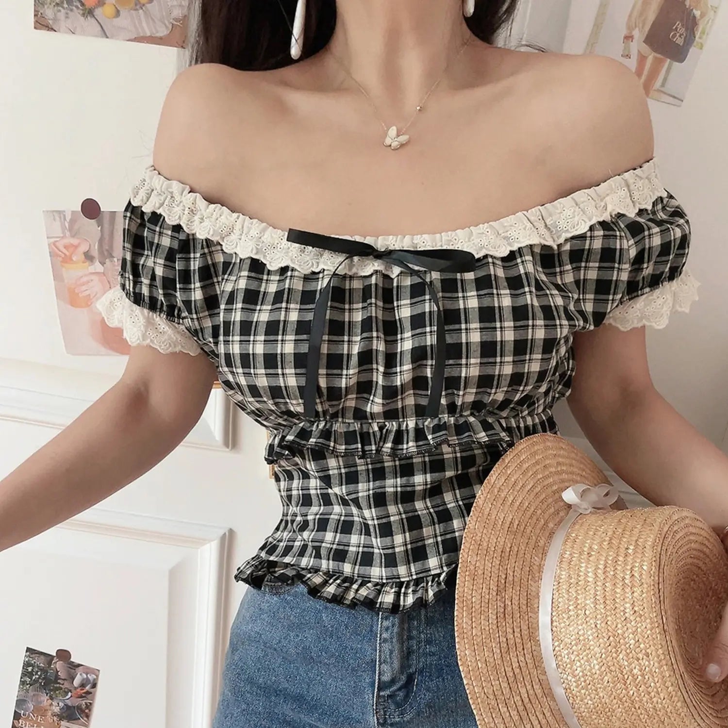 Women black white plaid lace off shoulder crop top, model holding pearl straw hat with denim indoor