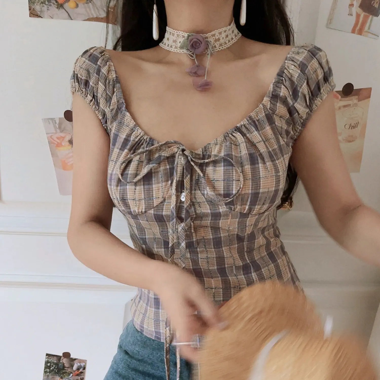 Women purple brown plaid puff sleeve crop top, adjustable front drawstring ruched fitted silhouette, dynamic partial indoor model shot
