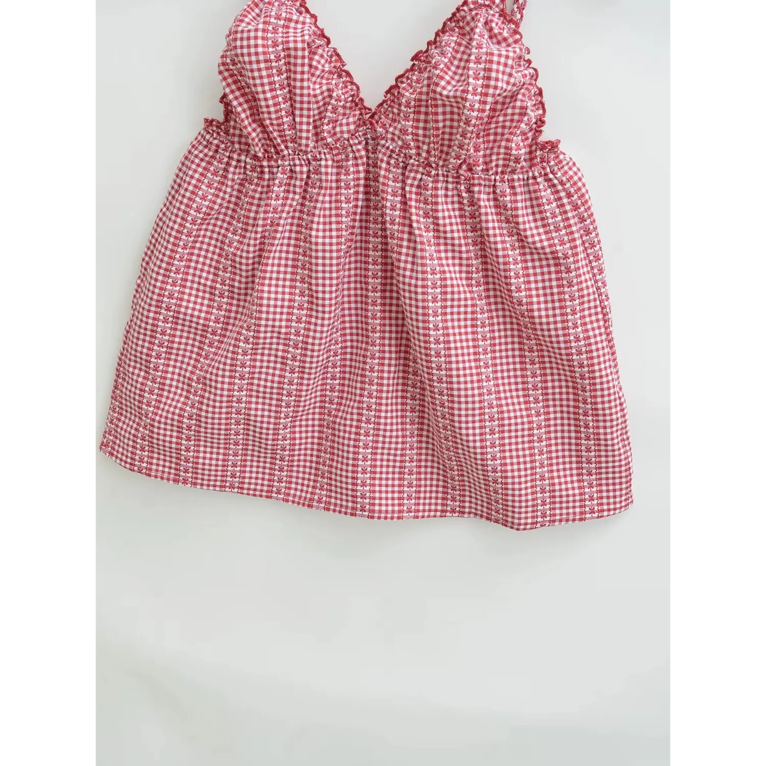 Red white tiny gingham floral cami hem macro flat shot, even small flower woven texture neat edge stitching white background detail