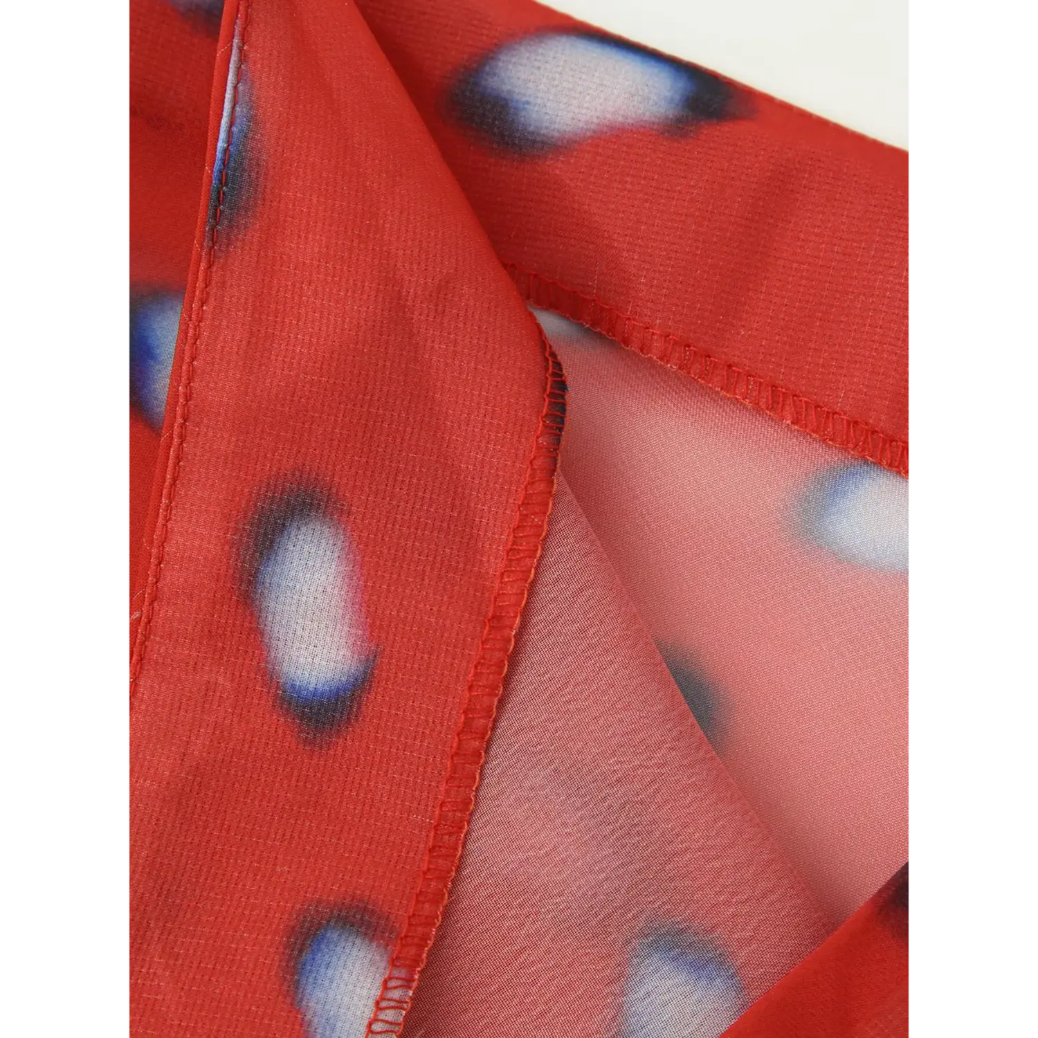 close up front wrap fly edge neat serged stitching red gradient dot chiffon midi skirt sheer fabric