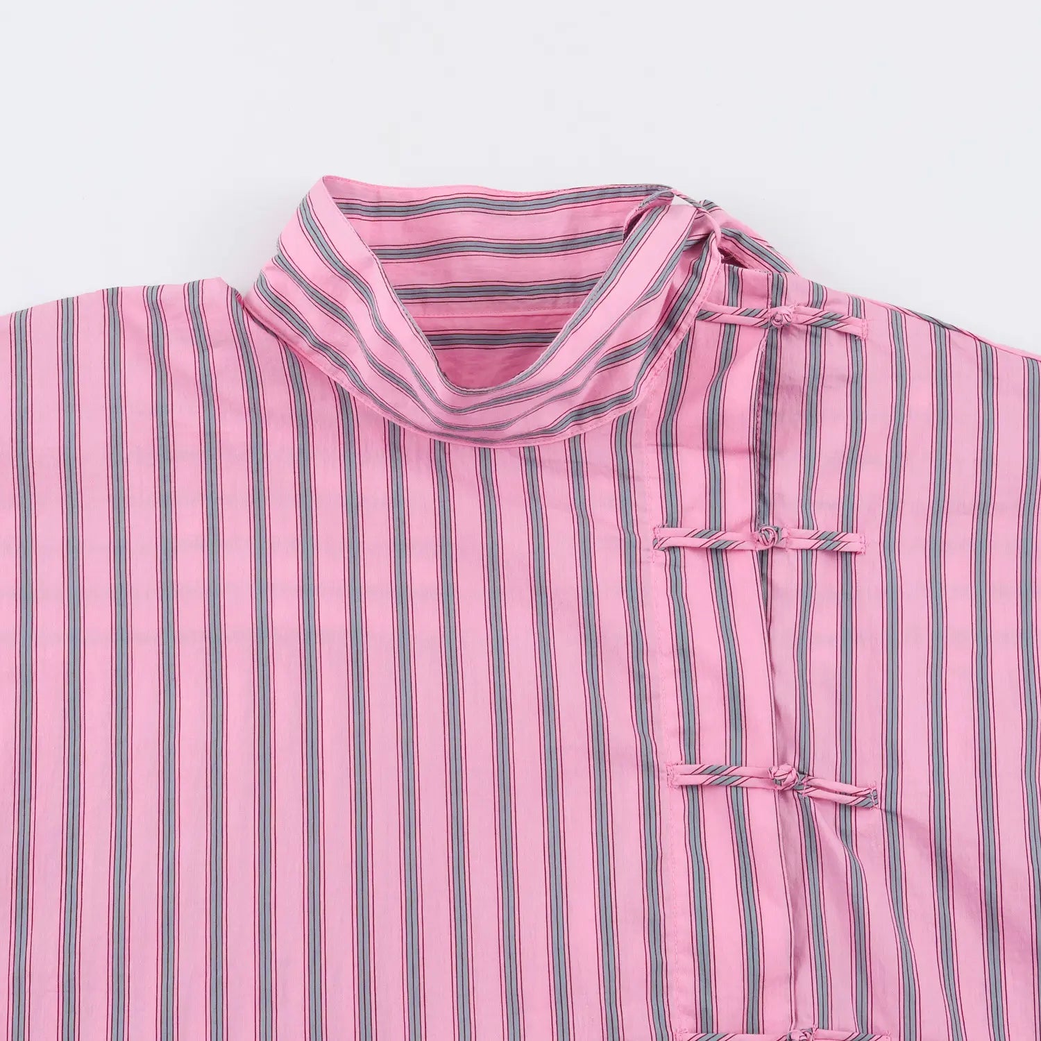Closeup wrap high neck, diagonal traditional chinese frog knot placket, vertical stripe woven fabric