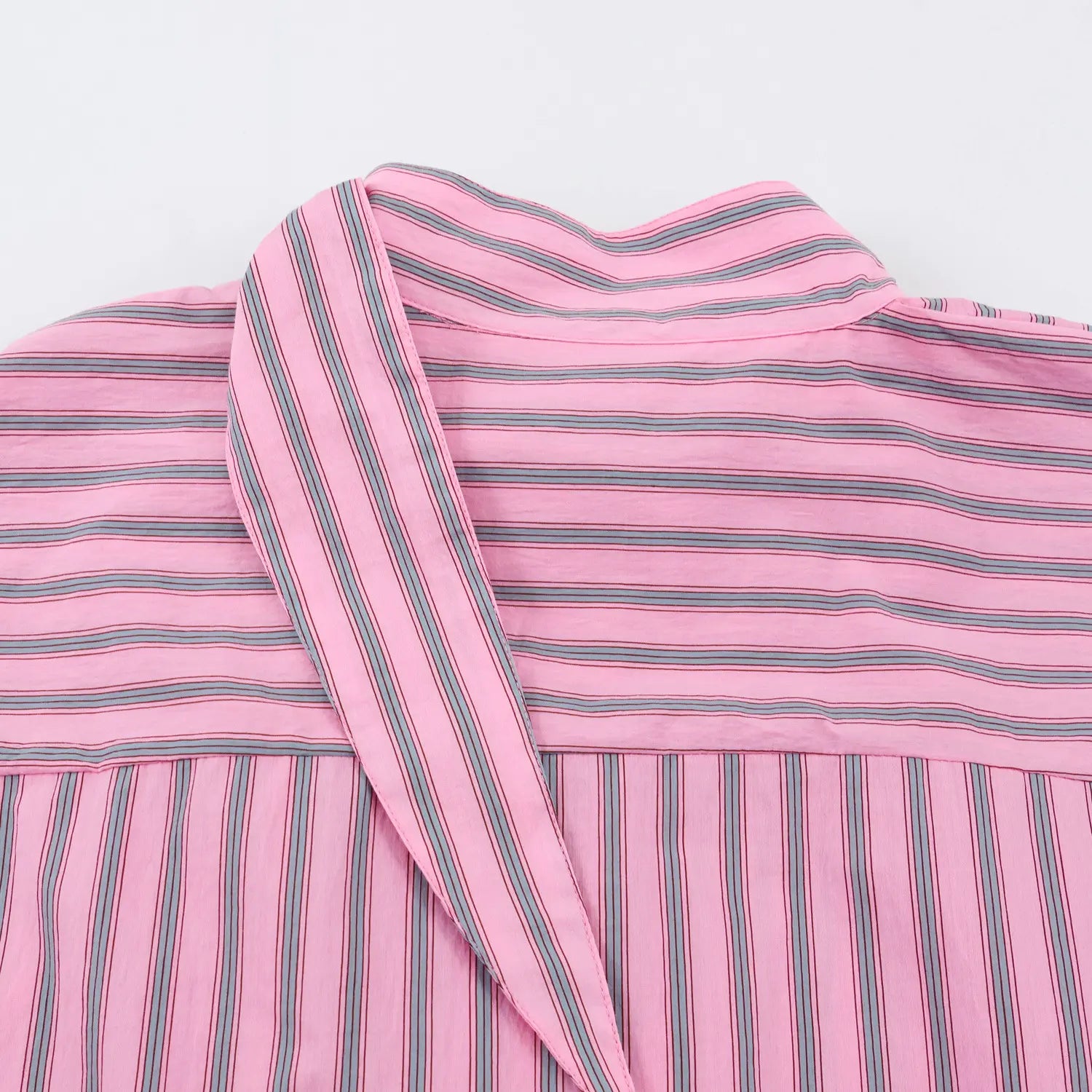 Back view stand collar with attached self-fabric sash, horizontal vertical stripe spliced yoke seam