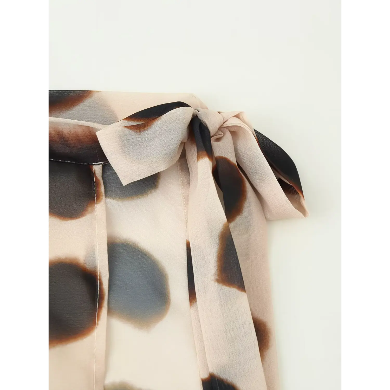Light nude watercolor spot printed chiffon wrap skirt adjustable side bow tie detail, soft sheer fabric