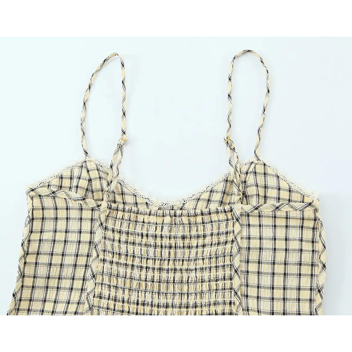 Back view of yellow black plaid camisole top with smocked elastic back