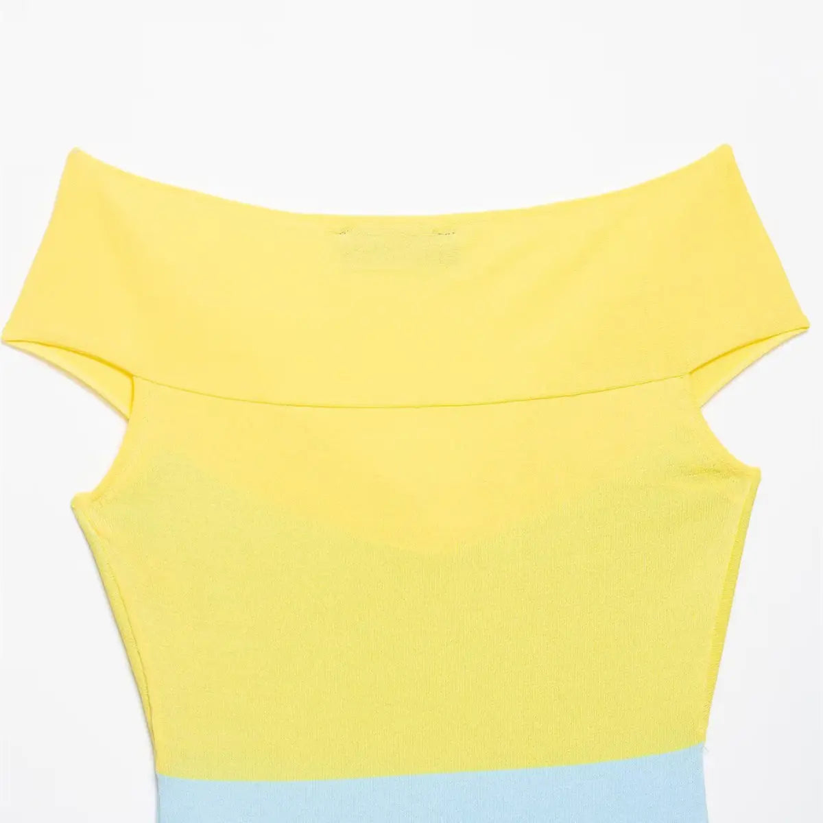 Back view of the yellow and blue color-block knit top, showing the off-the-shoulder neckline and color-block design