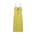 Back view isolated white background, yellow brown polka dot spaghetti strap midi dress with back tie detail