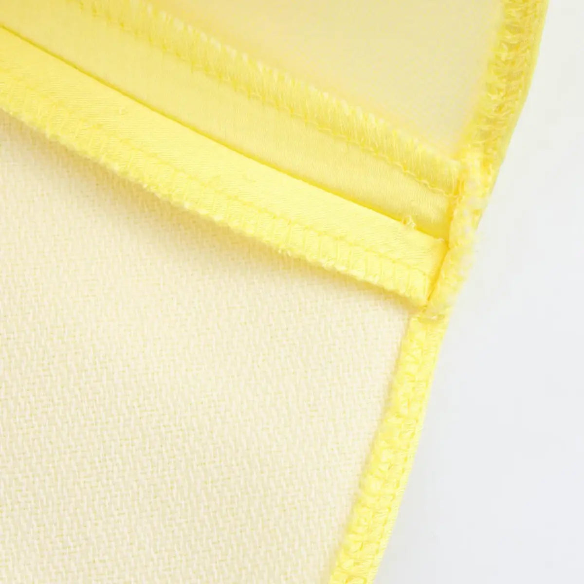 Close-up of the dress's hem, showing the neatly finished seams and inner lining.